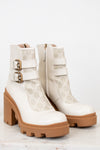 Gucci platform cream boots with gum sole on white background