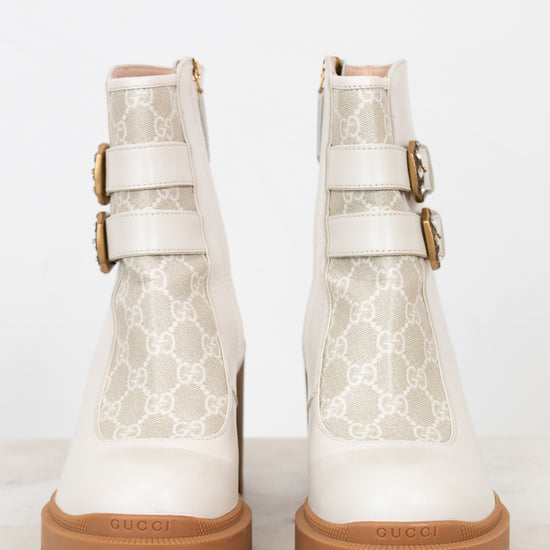 Gucci cream boots with platform tan sole on white background