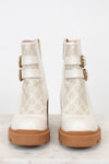 Gucci cream boots with platform tan sole on white background