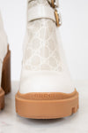 Gucci cream boots with platform tan sole on white background