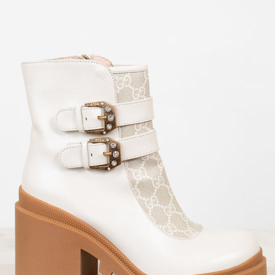 Gucci cream boots with platform tan sole on white background