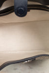 View of light fabric interior with navy leather bordering details