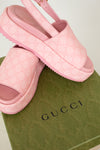 Pink GG Monogrammed platform shoes on green 'Gucci' box