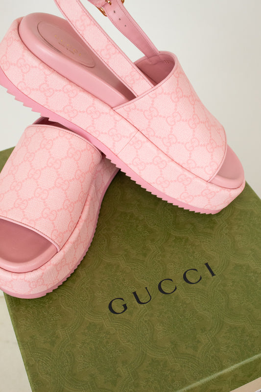 Pink GG Monogrammed platform shoes on green 'Gucci' box