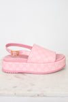 Side view of pink monogram platform sandals