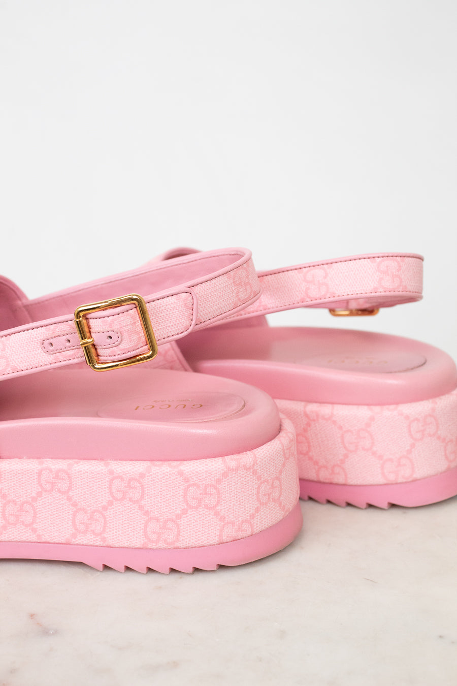 Heel view of pink monogram sling-back platform sandal