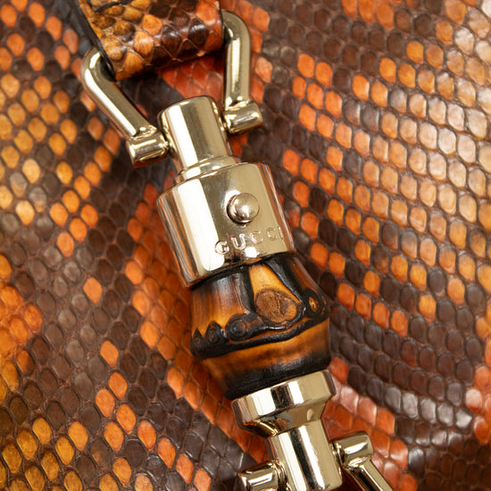 Close-up of a silver clip on a textured brown surface