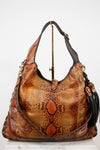 Brown snakeskin pattern handbag with gold accents on a white background