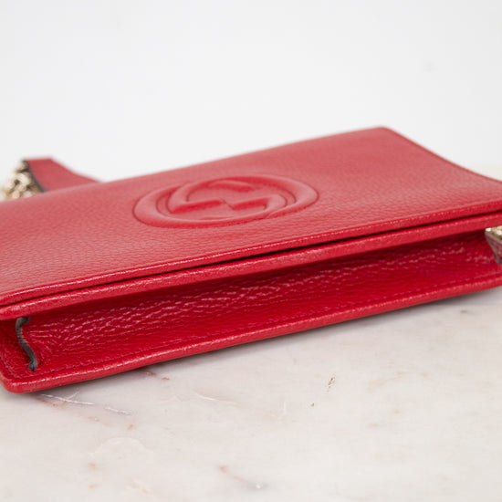 Red wallet on a marble surface