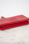 Red wallet on a marble surface