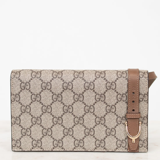 Designer handbag with a prominent brand logo on a white background