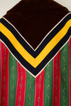 Jacket with brown top, yellow and black stripes, and red and green stripes with chain details.