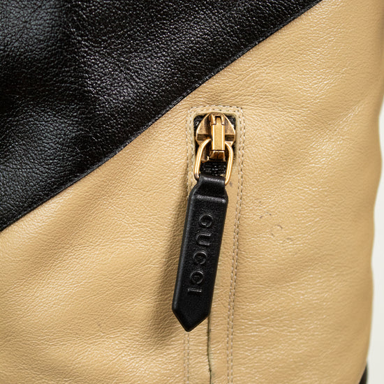 Close-up of 'GUCCI' black tab on zipper 