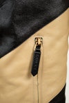 Close-up of 'GUCCI' black tab on zipper 