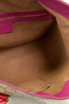 Close-up of a brown suede interior with pink interior and trim.