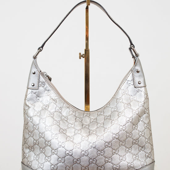 Silver Gucci handbag on a white background
