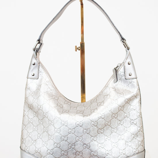 Silver Gucci handbag on a white background