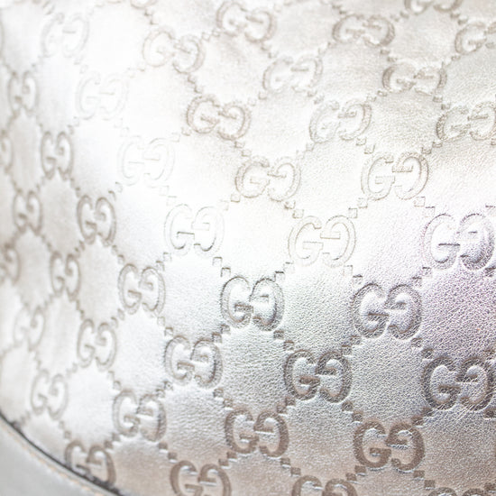 Close-up of a Gucci handbag with monogram pattern