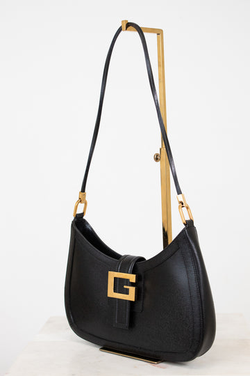 Black handbag with gold accents on a white background 