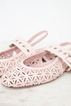 A pair of light pink leather ballet flats with laser-cut geometric star patterns and silver-tone metal eyelets on the straps, displayed on a light marble surface against a white background.