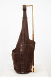 Brown leather hobo bag with buttons on a white background