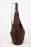 Brown leather bag with buttons on a white background