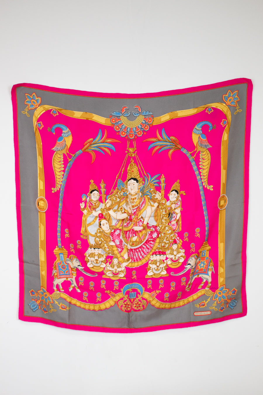 Decorative scarf with intricate design on a white background