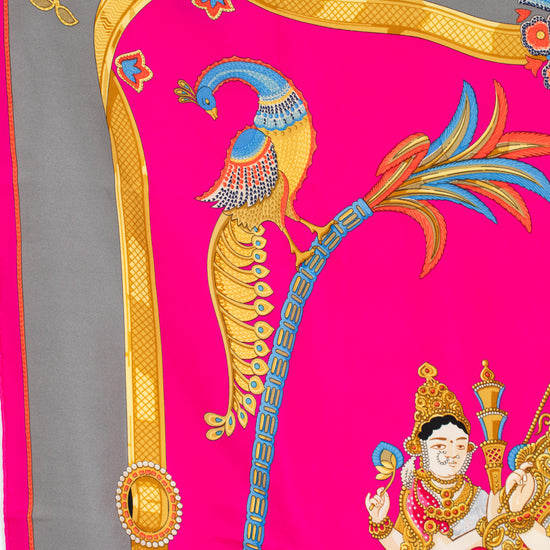 Decorative fabric with peacock design on a pink and gray background