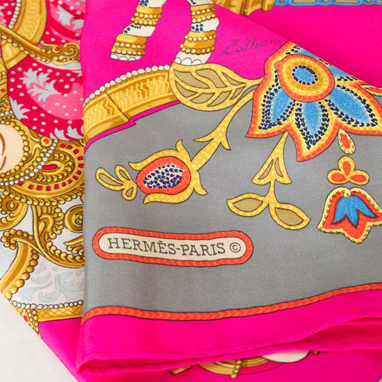 Hermes-Paris scarf with colorful patterns and brand logo on a white background