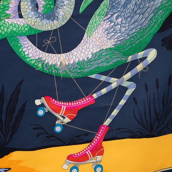 Colorful scarf with a design of legs in pink roller skates and a large green snake on a dark background.