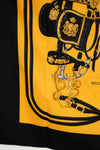 Equestrian-themed scarf with a horse bridle on a yellow background