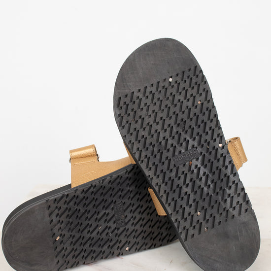 Bottom soles of gold and black sandal