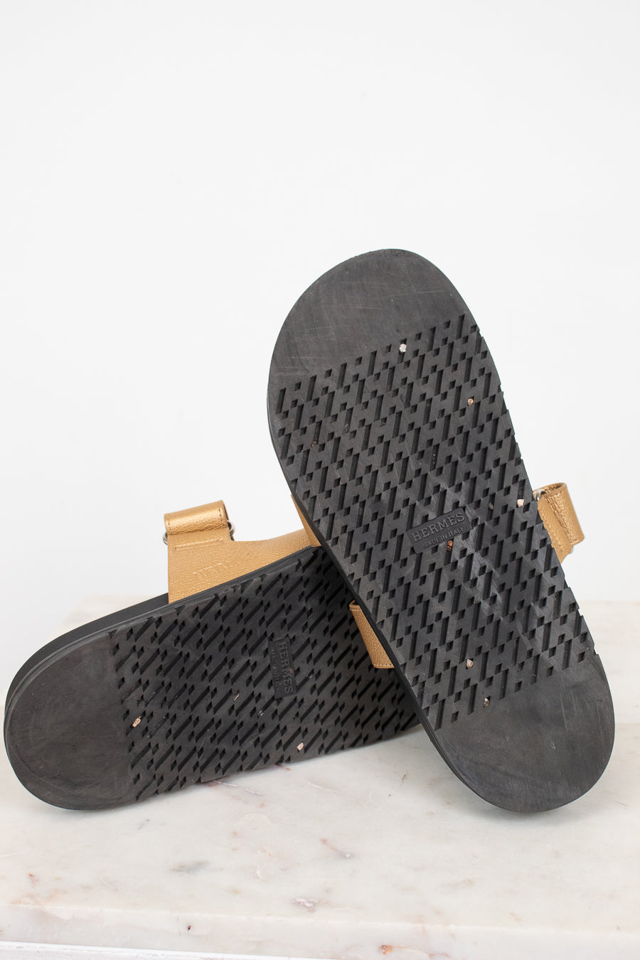 Bottom soles of gold and black sandal
