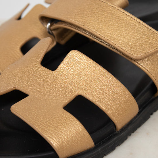 Close-up of gold and black sandal