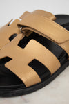 Close-up of gold and black sandal