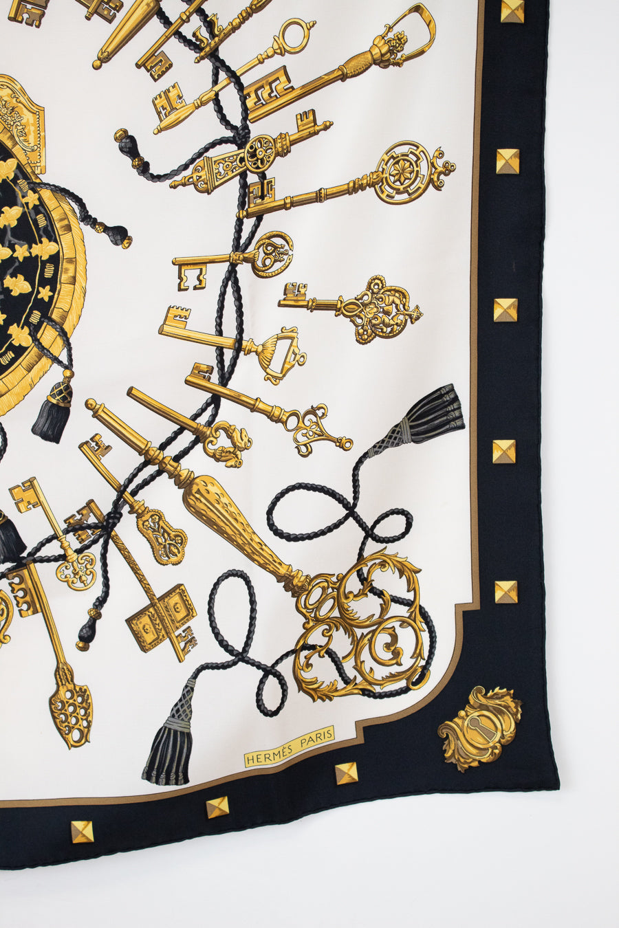 Designer scarf with gold keys and tassels print with a black border