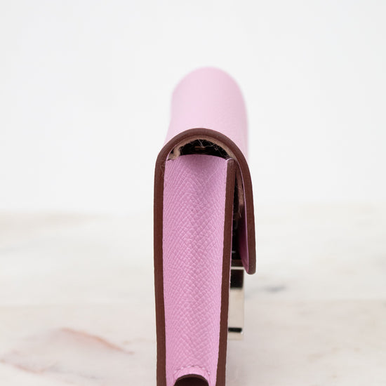 Pink and brown shoe on a white background