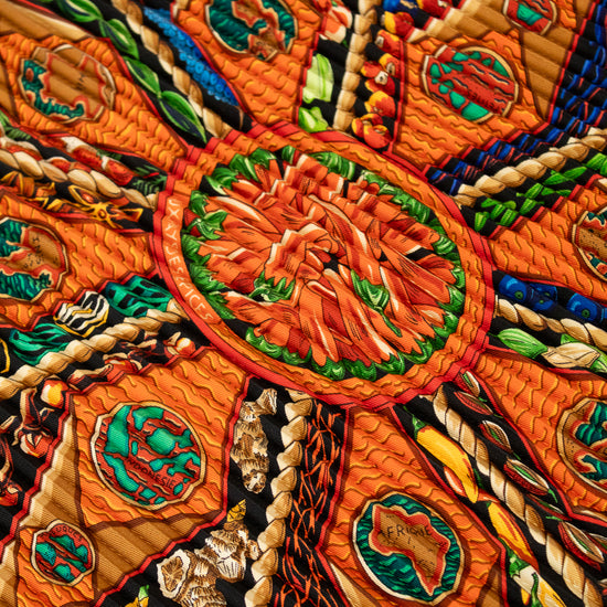Close-up of a colorful embroidered textile with intricate patterns