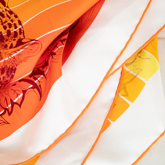 Silk scarf with colorful abstract design on a white background