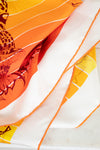 Silk scarf with colorful abstract design on a white background
