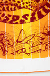 Hermes Paris scarf with leopard print and butterfly design on a yellow background