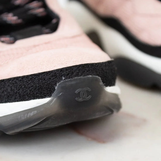 Close-up of a Chanel sneaker with a blurred background