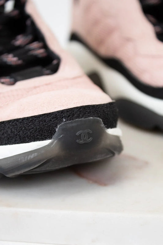 Close-up of a Chanel sneaker with a blurred background