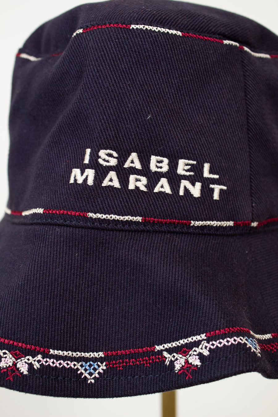 Navy blue bucket hat with 'Isabel Marant' branding on a white background
