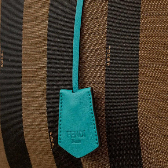 Brown and black striped bag with a turquoise Fendi tag.