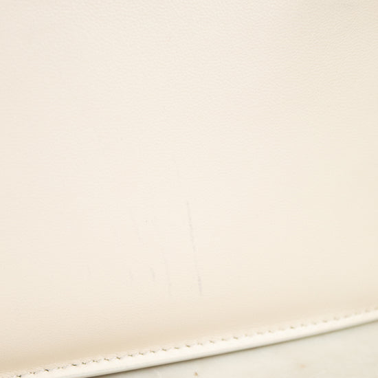 Close-up of a beige leather with a subtle mark on a light background
