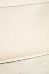 Close-up of a beige leather with a subtle mark on a light background
