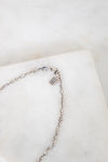 Brand logo on chain on white background
