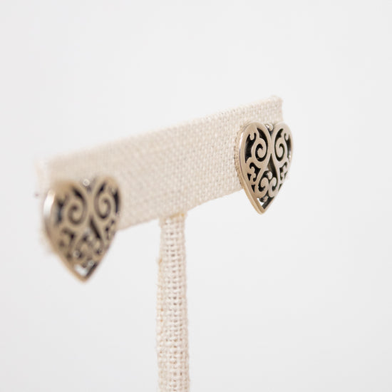 Pair of silver earrings on a white background