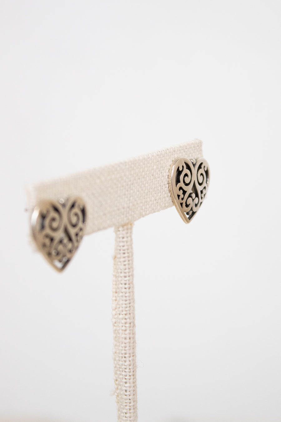 Pair of silver earrings on a white background